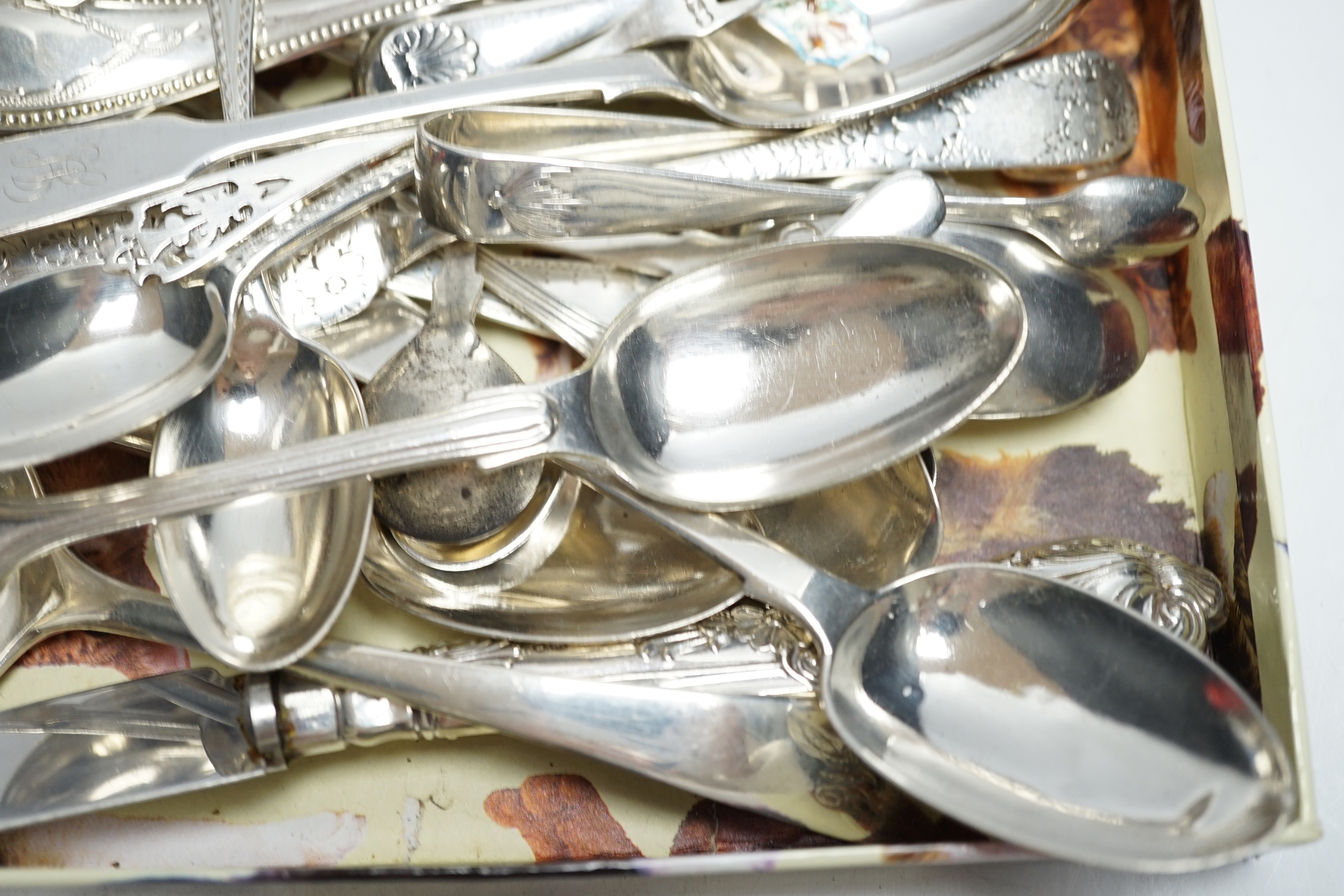 Sundry silver cutlery, including a butter knife, teaspoons, condiment spoons, sauce ladles, etc.